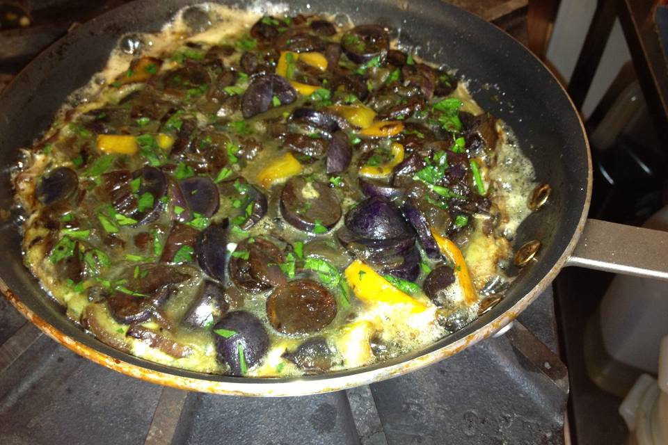 Tortilla espanola with purple potatoes, vegetarian