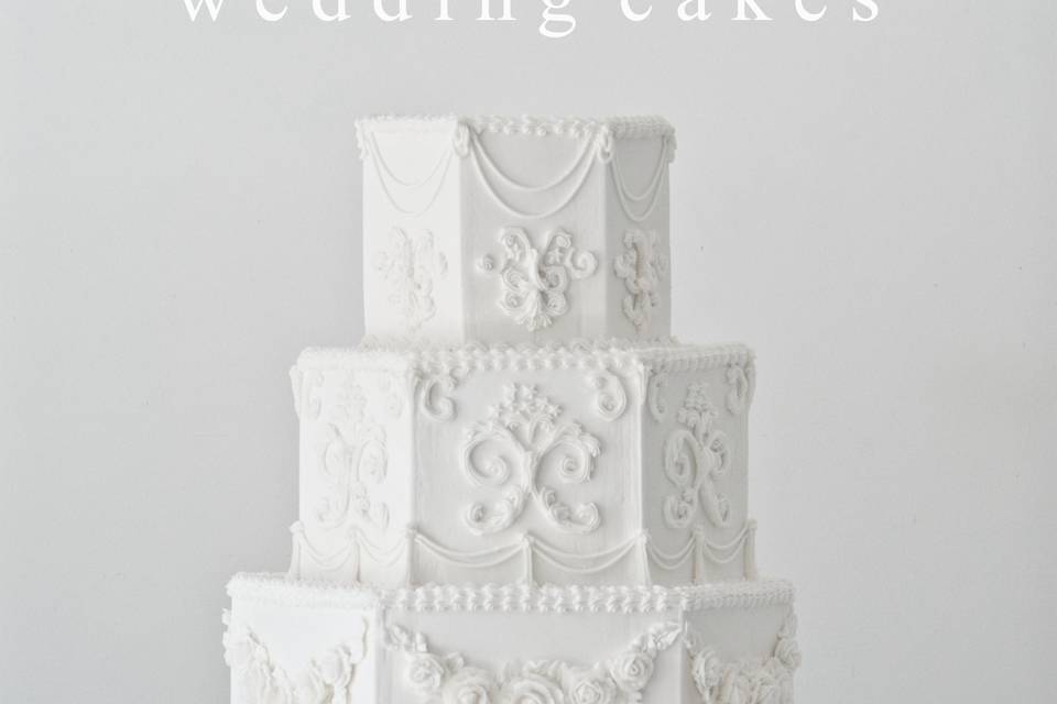 This victorian style hexagon wedding cake is a buttercream work of art.