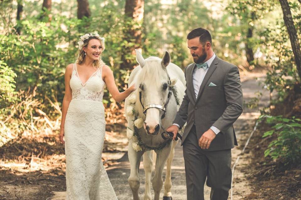 Lovely couple with a white horse