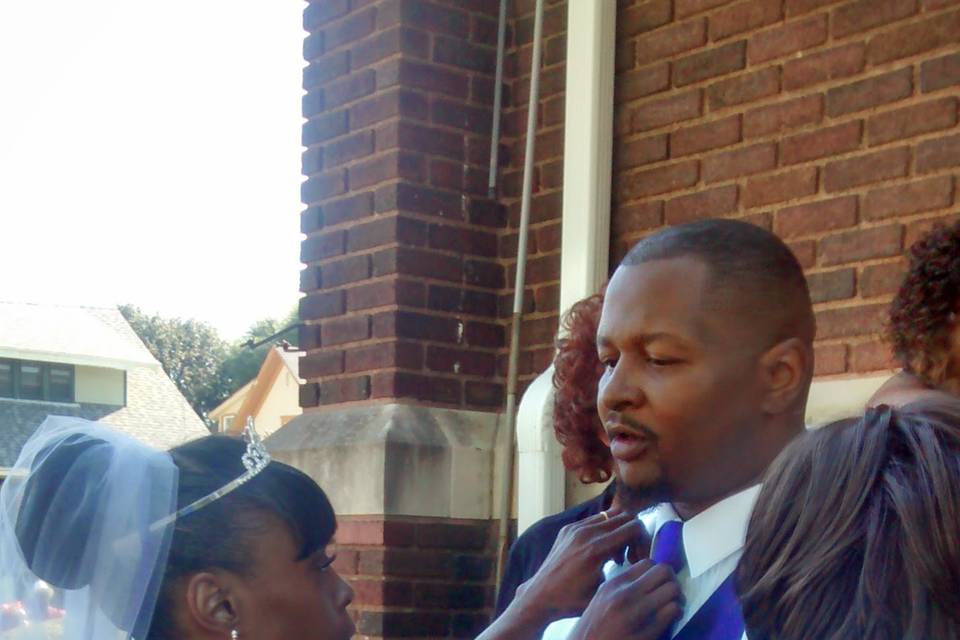 Bride fixing Groom tie