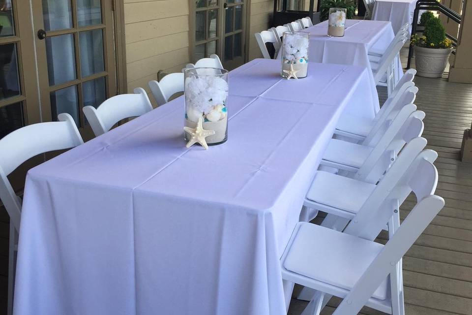 White resin chairs with linen