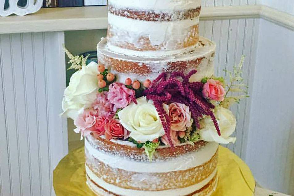 Naked wedding cake with flowers