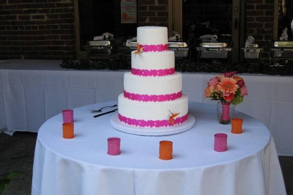 White, pink and orange were the inspiration colors for jason and kim, we try to mix them on the cake in the most simple way. Two tiers chocolate cake with raspberries filling and the other two with strawberries and french custard. This cake was specially made for this lovely couple.