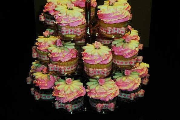 Cup cake tower ordered by Jenny's bridemaids, vanilla and chocolate walnut cupcakes filled with vanilla whip cream.