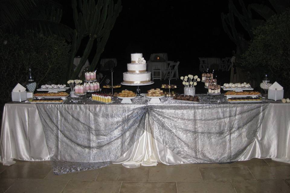 Dessert Table Buffet specially made for Cynthia and Richard Leu, Terranea Hotel in Palos Verdes, Ca.Assorted dessert like Strawberry Shots, Cookies and Cream Shots, Macaroons, Doboch, Petit Palmiers, Petit Four, Small Fruit tarts, Cup Cakes and Cake Pops.