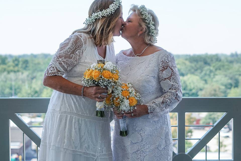 Brides kissing