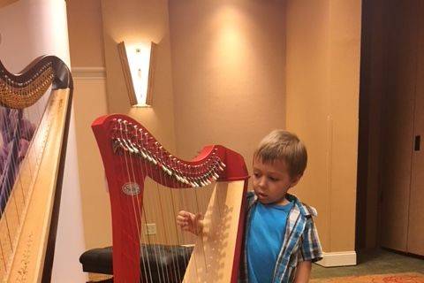 Kids love to try small harps!