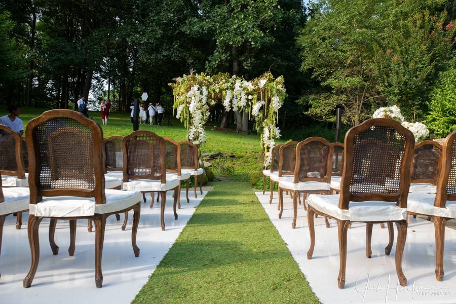 Ceremony chairs and floral arch