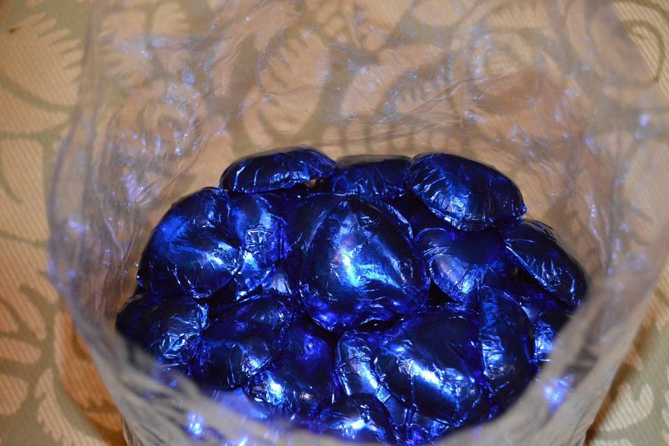 Royal blue foil chocolate heart wedding favors.