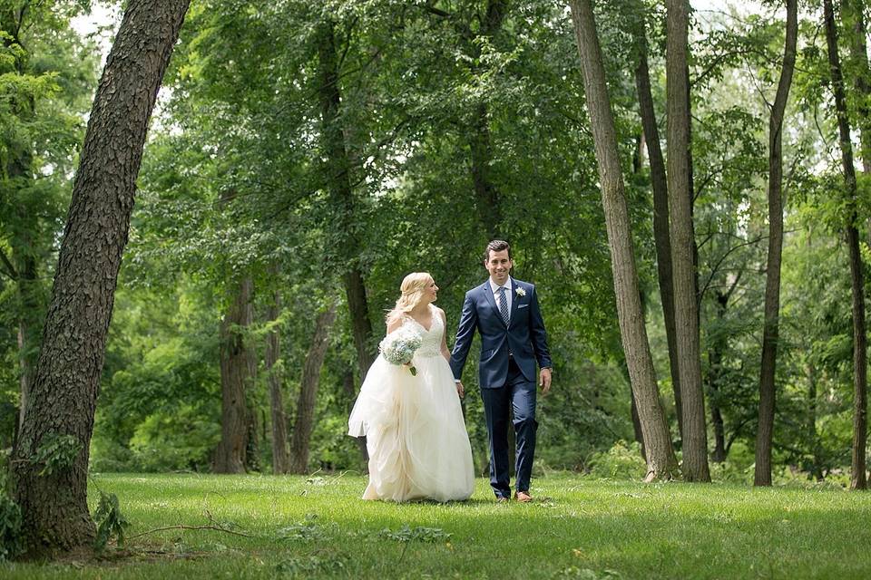 Bride and groom holding hands