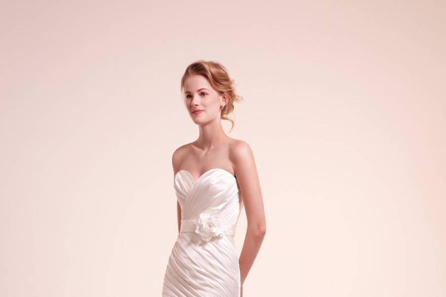 7806
Satin draped mermaid gown with rosette appliques