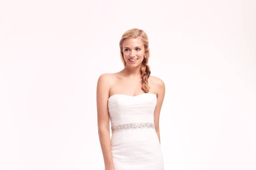 Style 32624462 <br> This mermaid gown features a strapless neckline with a natural waist in tulle. It has a chapel train. This gown is available in Plus Sizes, and is Exclusive to Kleinfeld Bridal.