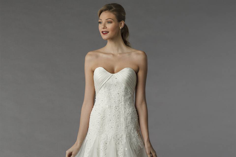 Style	12077	<br>	This a-line gown features a sweetheart neckline with in tulle and beaded embroidery. It has a chapel train.