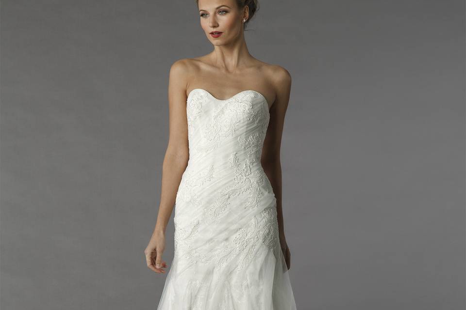 Style	12079	<br>	This a-line gown features a sweetheart neckline with a natural waist in tulle. It has a chapel train.