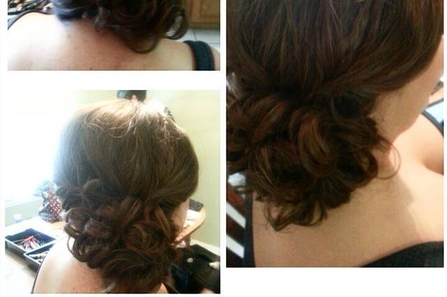 Thick side braid in front leading to a back low messy roll