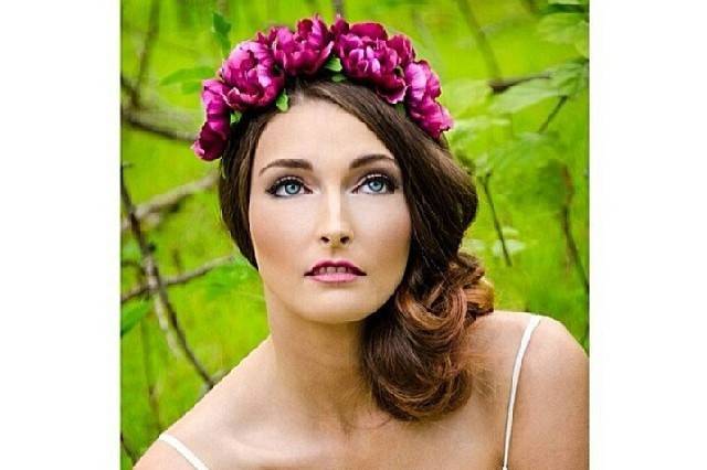 Loose low side updo to accent her organic flower headpiece. This look is great for the organic, simple bride who wants to have the focus on her natural beauty.