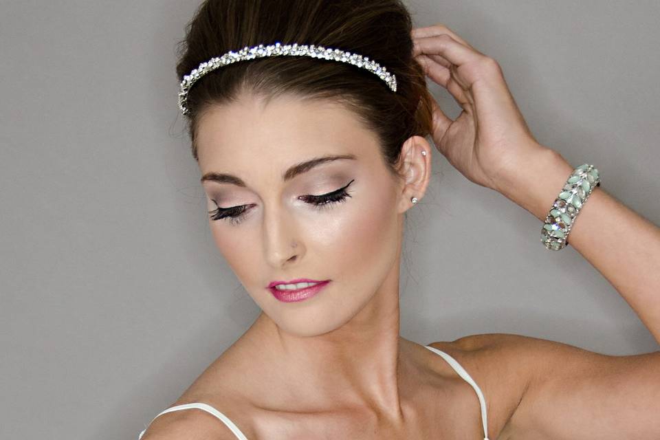 bouffant front with low bun in back and crystal headband