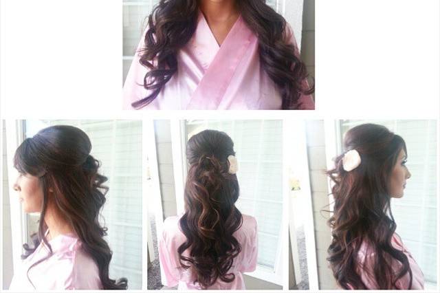 Half up style with big curls and accent flower.