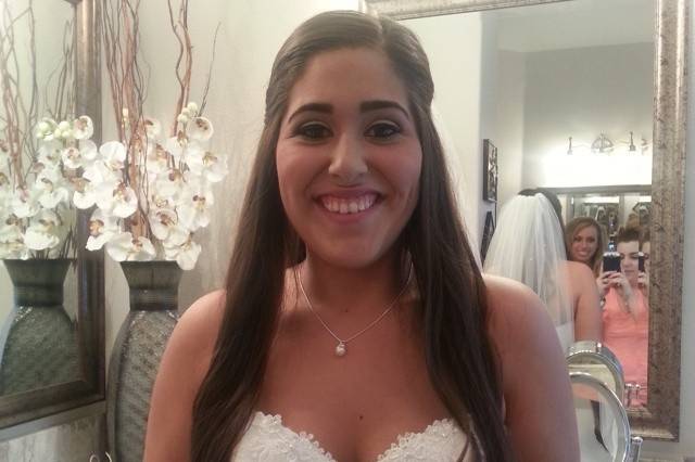 Lush Bride with a simple half up style with loose curls