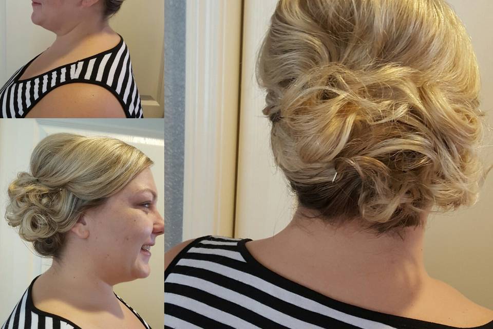 This flower girl looks so cute with her messy side high bun and accent flower.