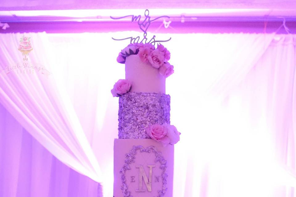 Elegant buttercream wedding cake with edible sequins