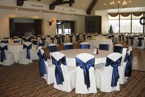 white chair cover w/ navy blue satin sashes