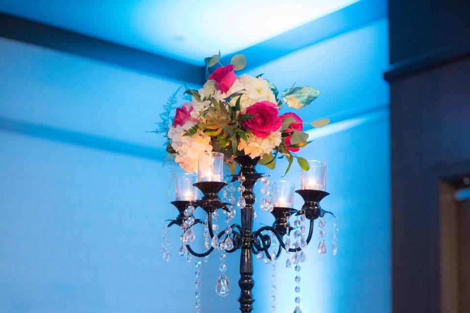 Table set-up with lantern and flower centerpiece