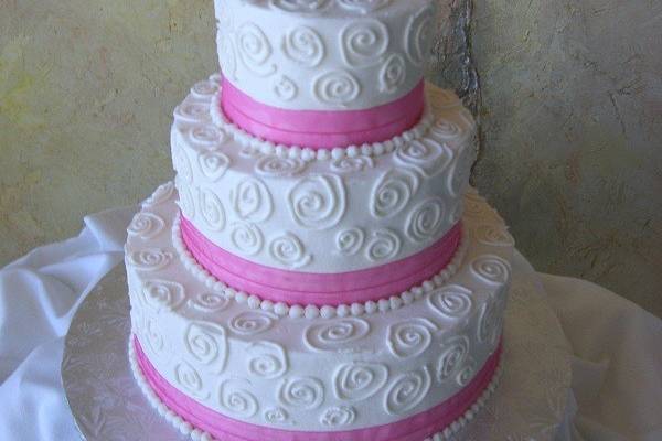 3-tier wedding cake with pink detailing