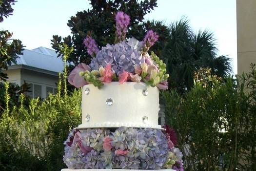 3-tier wedding cake with flowers in between