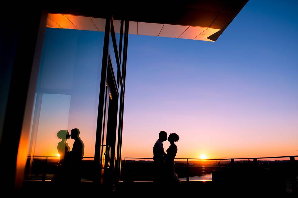 Couple kissing at sunset - Tall + Small Photography