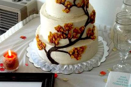 Tiered Wedding Cake - Fall Foliage - Three tiered carrot cake with cream cheese frosting, decorated with buttercream leaves
