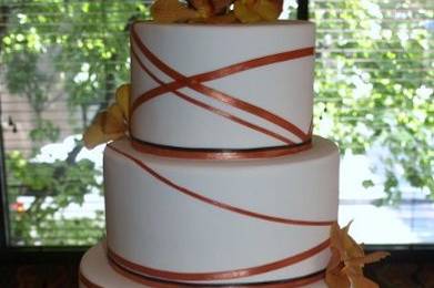 Ribbon Wrap Cake in Fall colors: burnt orange and chocolate brown.