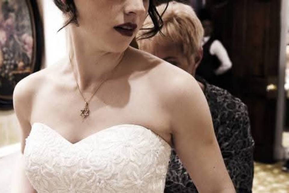Bride getting dressed