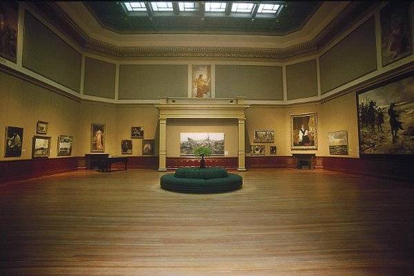 Added to the house museum in 1890, the Telfair's Rotunda space is a dark wood paneled wall lined with amazing works of art.
