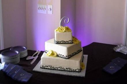 Singleton-Chaputa Cake with purple accent up-lighting behind it.  We always try and use our lighting to accent your cake (At no extra charge!)