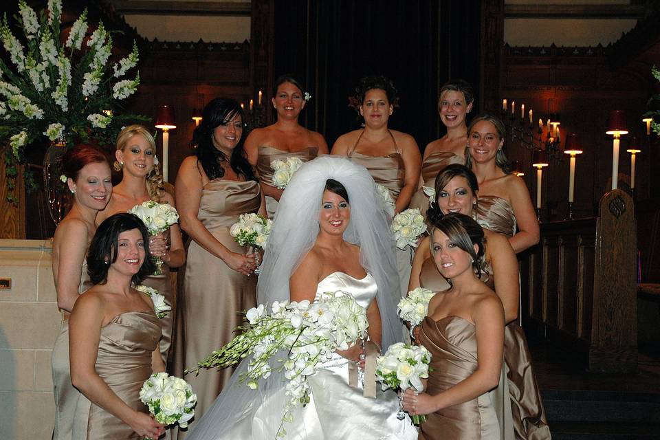 Bridesmaids around their bride