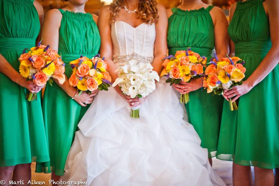 Bride and bridesmaids holding their bouquets