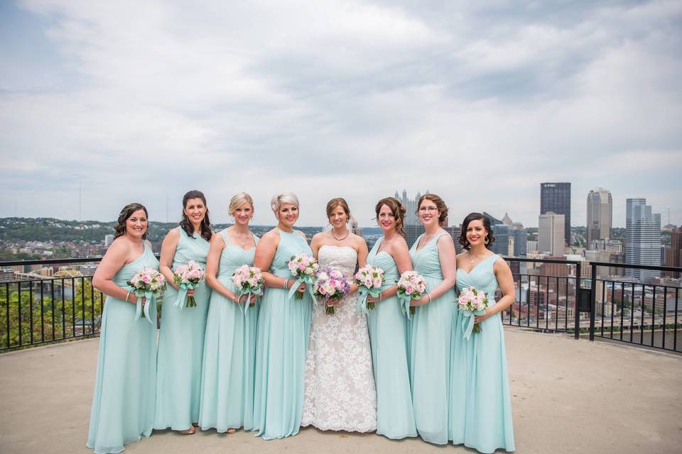 Bride and bridesmaids with bouquets in hand
