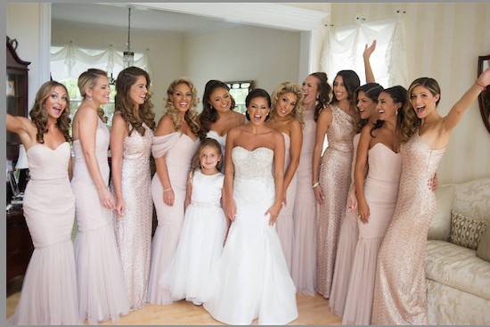 Bridemaids wearing blush dresses by Amsale Bridesmaids in tulle and sequin