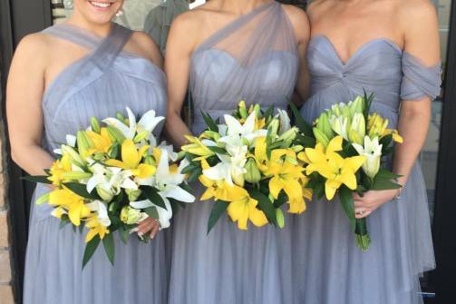 Boho bridesmaid dresses in grey! High neck, one shoulder, and off the shoulder styles in a dark grey tulle.