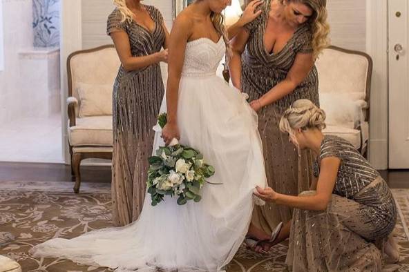 Bridesmaids wearing beaded dresses in beige by Adrianna Papell.
