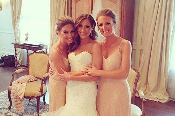 Bridesmaids in the classic beaded blouson dress by Adrianna Papell.
