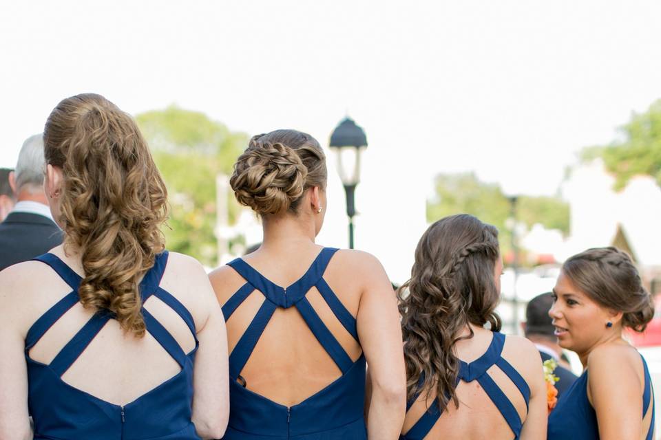 Bari Jay bridesmaids wearing an open back style in navy.