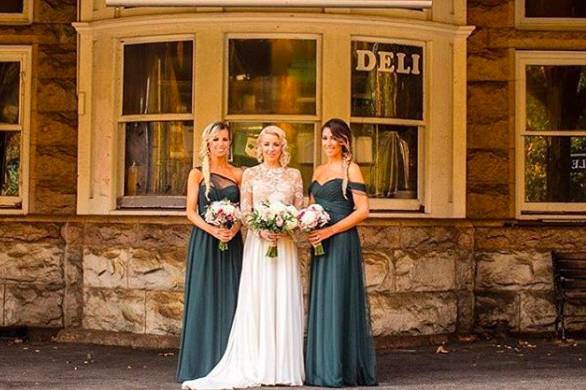 Bridesmaids wearing dresses by Amsale in hunter green! Such a great color.