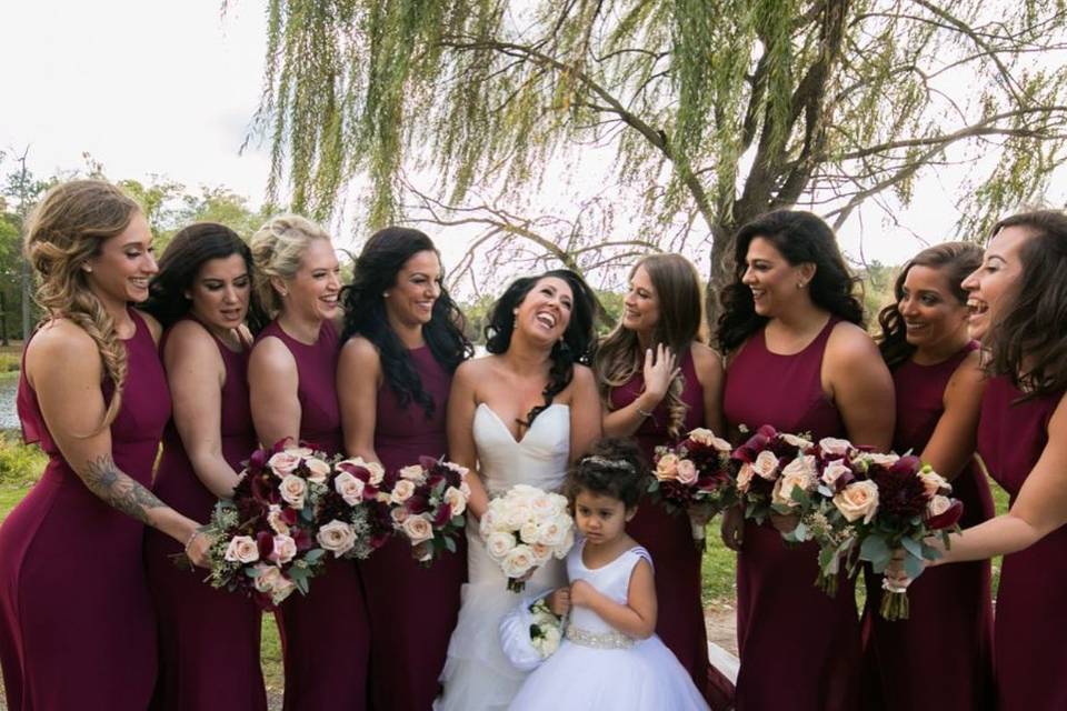 Hayley Paige burgundy chiffon bridesmaid gowns with back sheer overlay and center slit. Styled in our Studio.