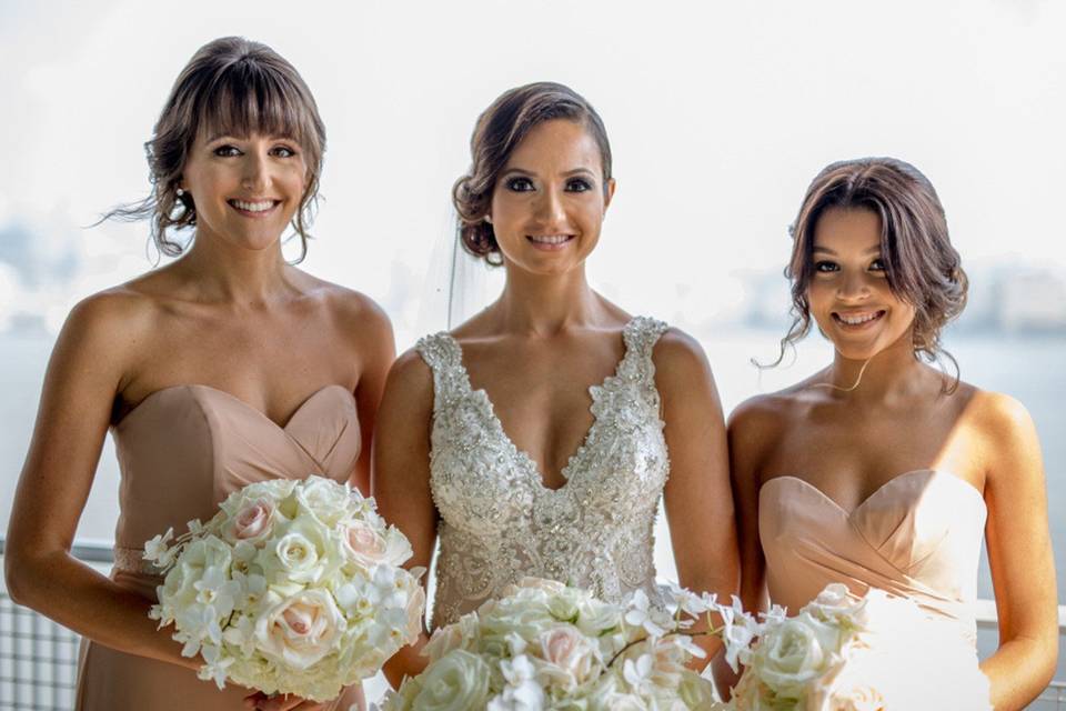 Bridesmaids wearing a strapless dress by Bari Jay. A perfect shade of nude.