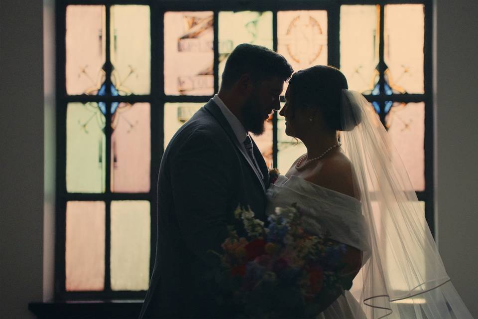 Bride and groom laughing together during their Ponchatoula, Louisiana, wedding filmed by Enchanted Cinema Co.jpg