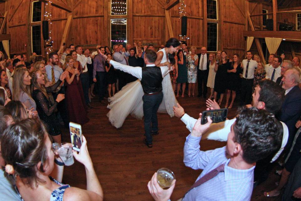 Groom lifting his bride