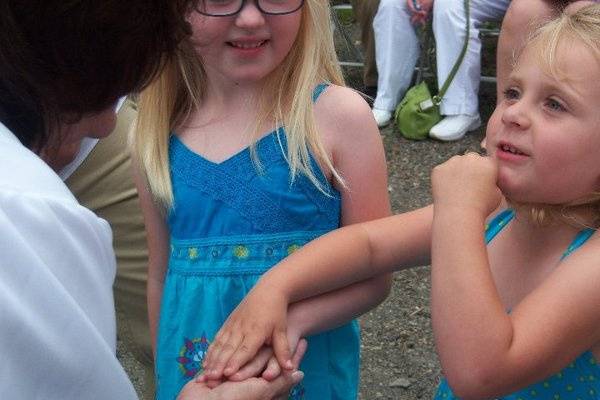 Flower girls with the officiant