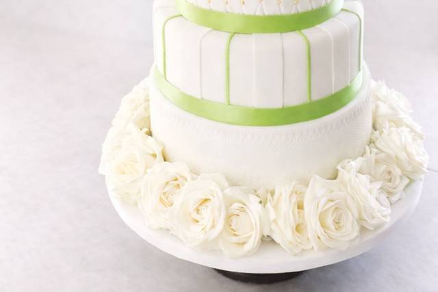 classic-white-wedding-cake-green-bow-floral-fort-collins.jpg